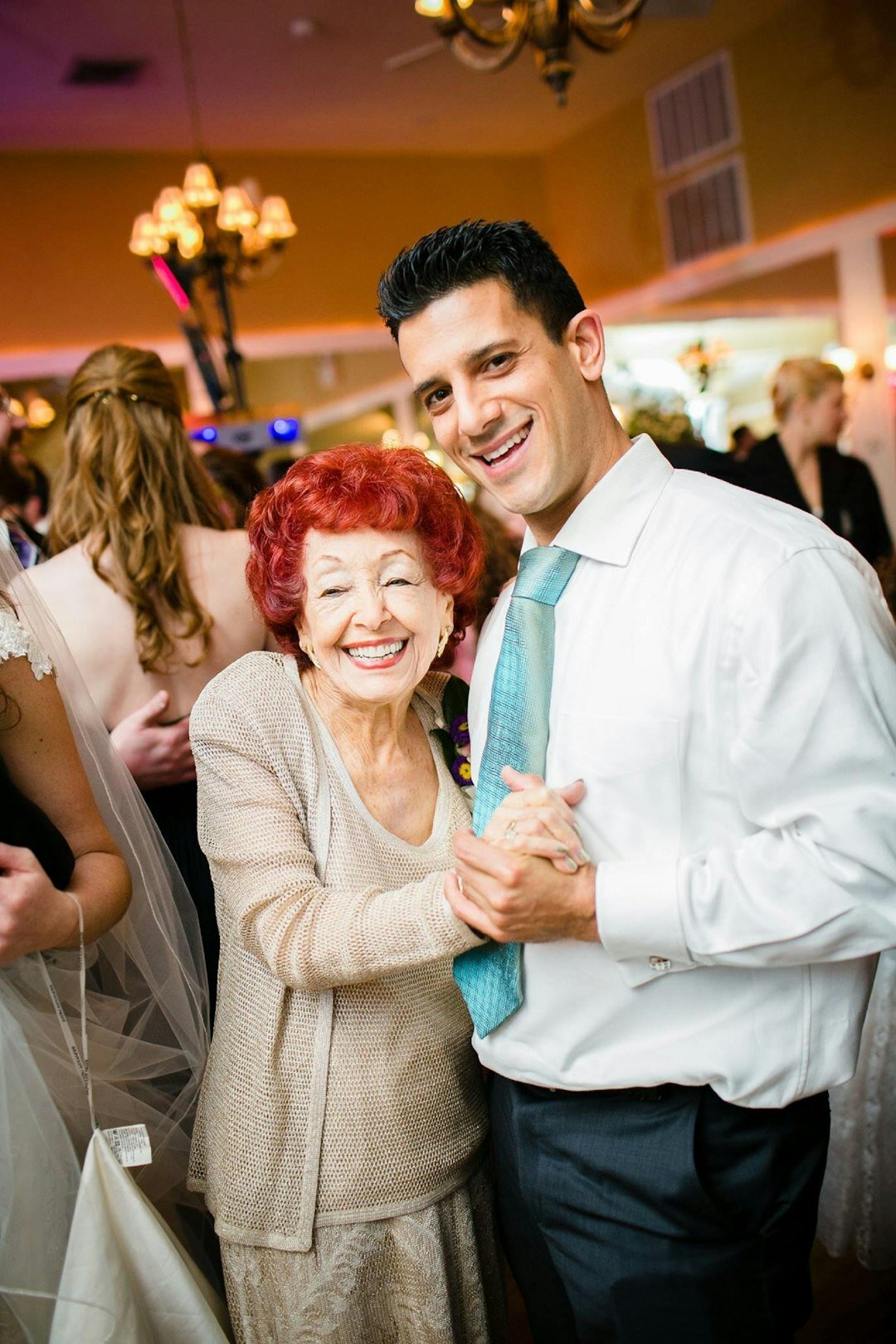 Seniors dancing together in a community hall