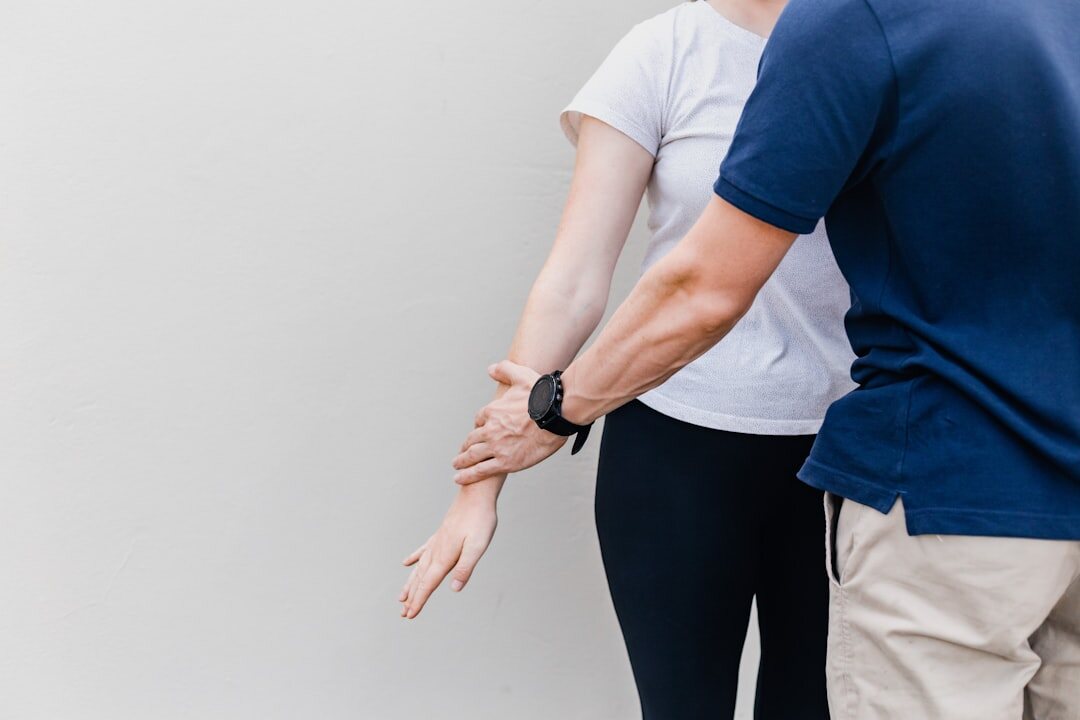 Physiotherapist guiding seniors through balance exercises